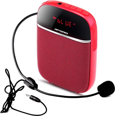 A red portable voice amplifier with a headset microphone is shown against a white background.