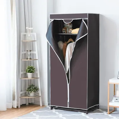 A portable wardrobe with clothes inside, placed next to a corner shelf with plants and decor.