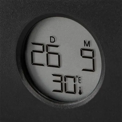 A close-up of a digital display showing temperature and time.