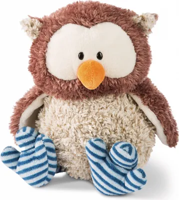 A plush owl toy is sitting down, facing the camera.