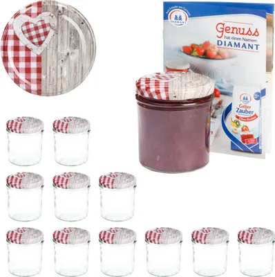 A set of glass jars with red and white checkered lids, a decorative plate with a wooden heart, and a recipe booklet for jam.