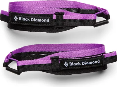 Zwei schwarze und lila Riemen für Stöcke; Modell "Womens Distance Z Straps" von Black Diamond.