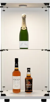 Alcoholic beverages displayed in a modern glass cabinet with interior lighting.