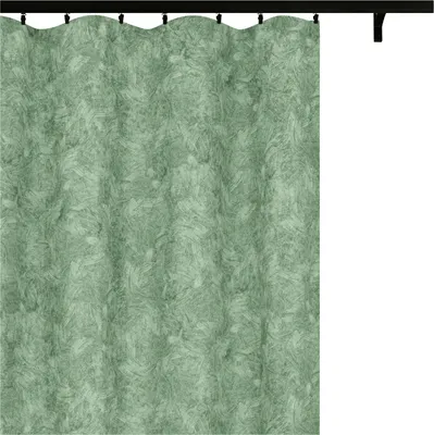 A green curtain hanging from a curtain rod.