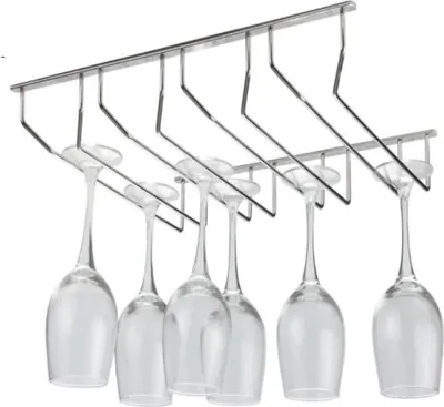 A metal rack holding several wine glasses, suspended from above.