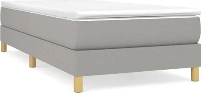 A bed frame with a mattress on top, shown from a side angle on a white background.