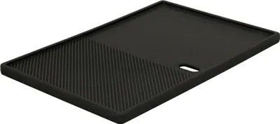 A black cast iron grill plate with a ribbed section and a smooth section, shown from a slightly elevated angle on a white background.