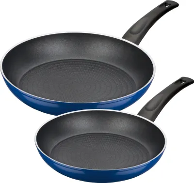 Two frying pans are shown from a slightly elevated diagonal angle against a white background.