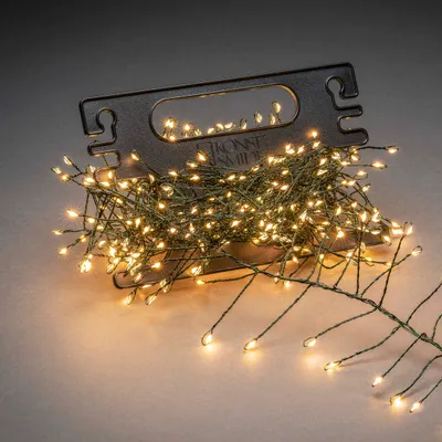 A string of LED lights coiled on a dark holder.