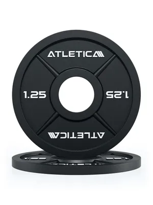 Two black weight plates are stacked on a white background. The top plate is angled towards the viewer.