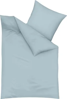 A light blue pillowcase and duvet cover are laid out on a white background.