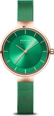 A close-up studio shot of a green Bering solar watch with a rose gold case and mesh strap.