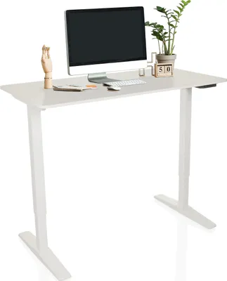 A white standing desk with a computer monitor, keyboard, mouse, and decorative items.