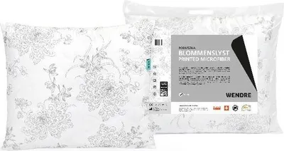 A pillow inside its packaging, with a label showing product details.