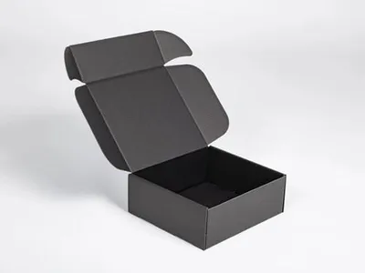 A black cardboard box with its lid open, shown against a plain white background.