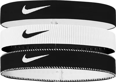 A stack of three Nike headbands.