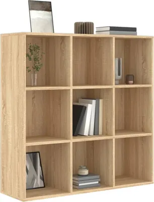 A wooden bookshelf with multiple compartments, some of which are filled with books and decorative items.