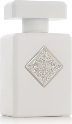 A white perfume bottle with a silver emblem on a white background.