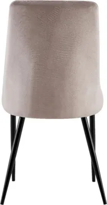 The back view of a beige upholstered chair with black metal legs.