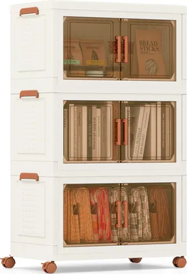 A stack of three white storage boxes with transparent brown doors and copper handles, each containing different items.