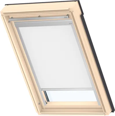 A close-up view of a VELUX skylight window with a white roller blind partially lowered.