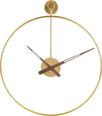 A close-up studio shot of a modern, minimalist wall clock with a gold metal frame and dark brown hands.