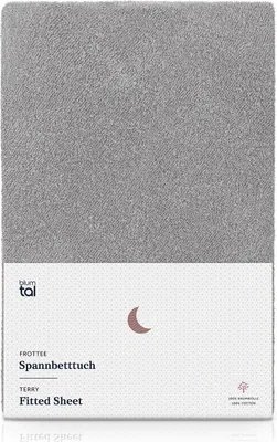 A flat lay image of a gray fitted sheet with branding and product information.