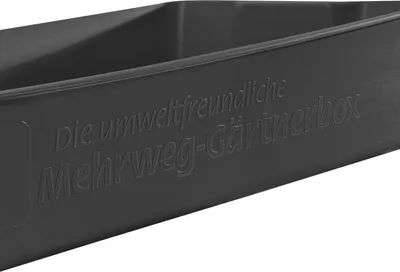A close-up view of a dark gray plastic box with embossed text on its side.