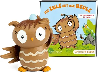 A toy owl figurine and a children's audiobook cover are displayed together.