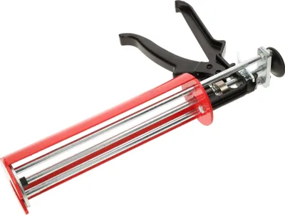 A professional studio shot of a caulking gun against a white background.