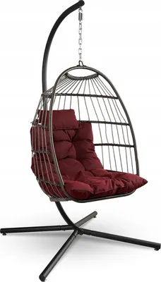 A hanging egg chair with a stand and cushion, shown against a white background.