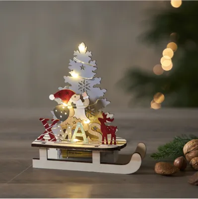 Zdjęcie produktu dla Scenka świąteczna drewniana Św. Mikołaj na saniach Led REINBEK