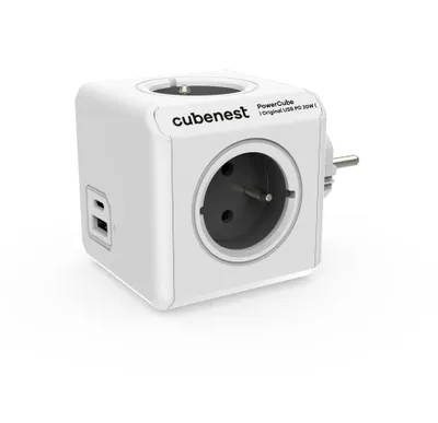 A white cube-shaped power adapter with multiple outlets and USB ports, shown on a white background.