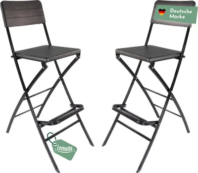Two black folding bar stools are shown against a white background.