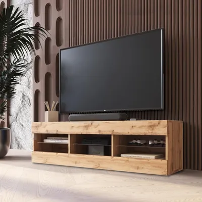 A modern living room with a TV stand and television.
