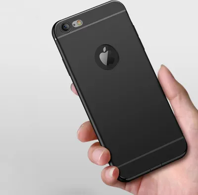 A hand holding a black iPhone 5 case.