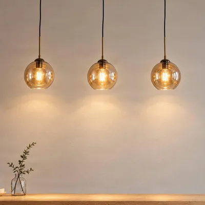 Immagine prodotto di Pendente Lindby Sofian, ambra, vetro, 100 cm, 3 colori