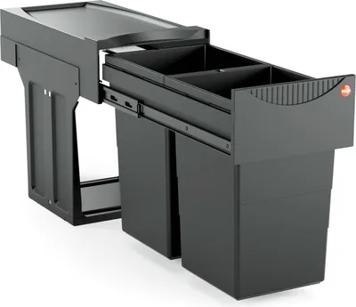 A black kitchen waste bin system with multiple compartments, shown pulled out from a cabinet.