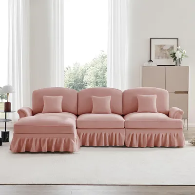 Produktbild von Modulares Mid-Century L-förmiges 3-Sitzer Sofa aus Chenille mit Trichter-Armlehnen, abnehmbarer Rüschenschürze, spindelförmigen Beinen & beweglichem Hocker – Tiefer Sitzkomfort fürs Wohnzimmer,rosa
