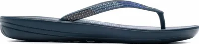 A side view of a single flip-flop sandal.