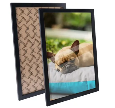 Two black picture frames are shown, one in front of the other. The front frame displays a picture of a sleeping French bulldog on a cushion. The back frame shows a patterned backing.