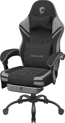 A black and gray gaming chair with a footrest.