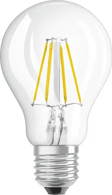 A clear studio shot of an LED filament light bulb.