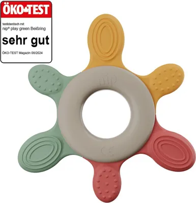 A colorful baby teether ring with a star-like shape, placed on a white background. A prominent "ÖKO-TEST" certification badge is visible in the top-left corner.