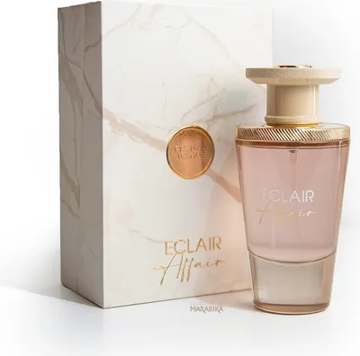 A perfume bottle and its box are displayed on a white surface with a light gray shadow.