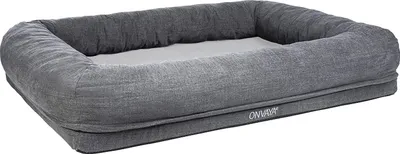 A gray dog bed is shown against a white background.