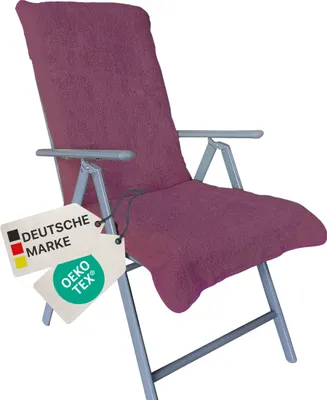 A purple chair cover on a folding chair, with two tags attached.