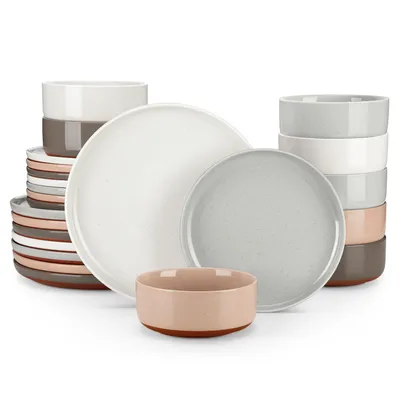A collection of ceramic plates and bowls stacked and arranged on a white background.