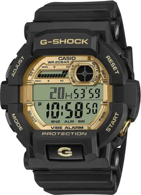 A close-up, front-facing view of a black and gold G-SHOCK digital watch.