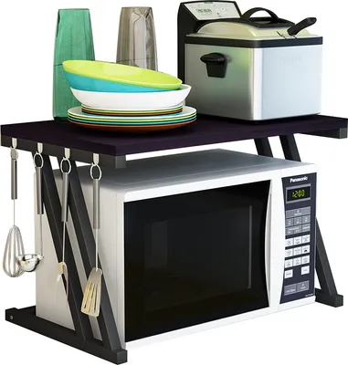A microwave oven stand with kitchenware and appliances on it.